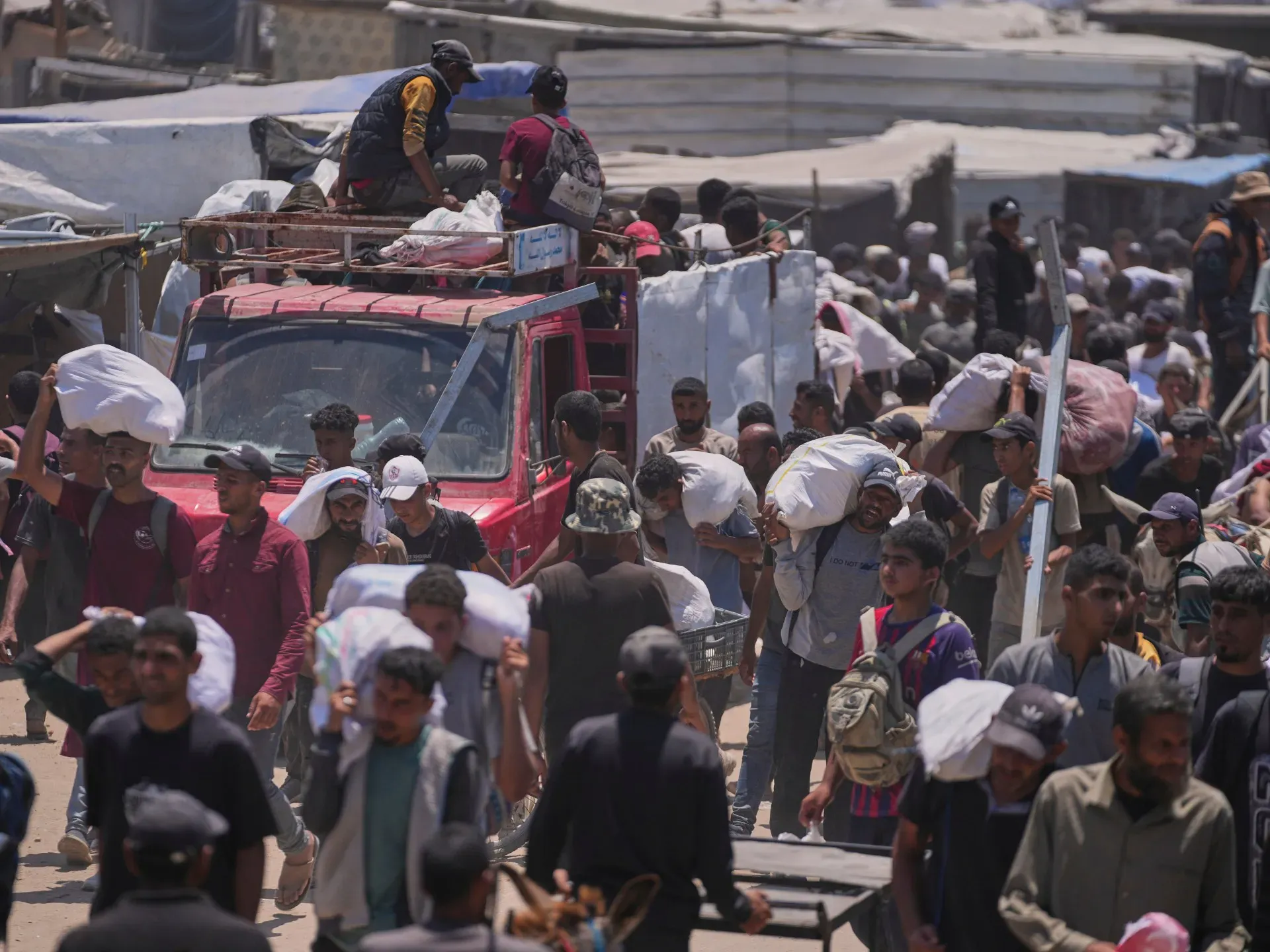 Israel kills at least 58 people in Gaza, many at US-backed aid site: Medics