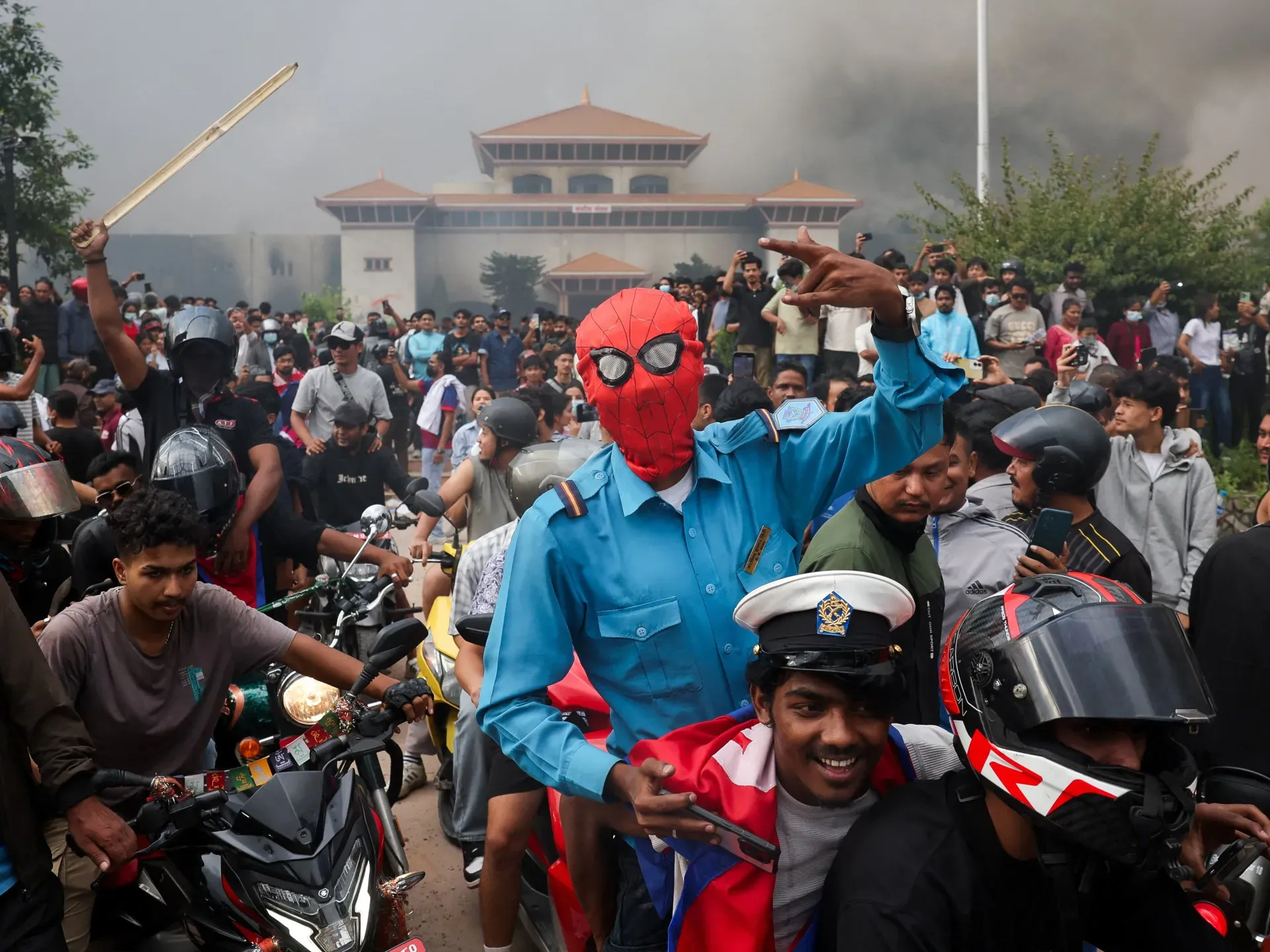 Protesters torch Nepal parliament as PM resigns amid turmoil