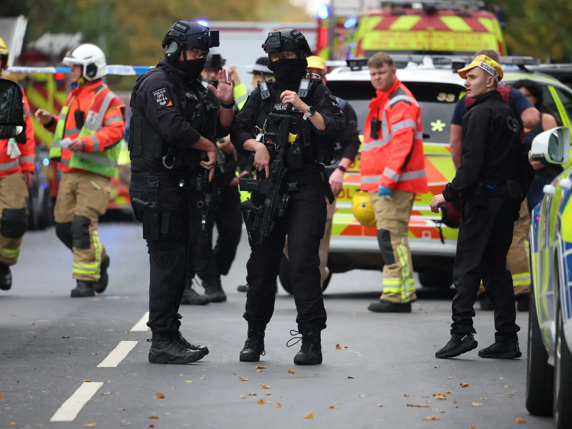 Police say one victim possibly shot by officer during Manchester attack